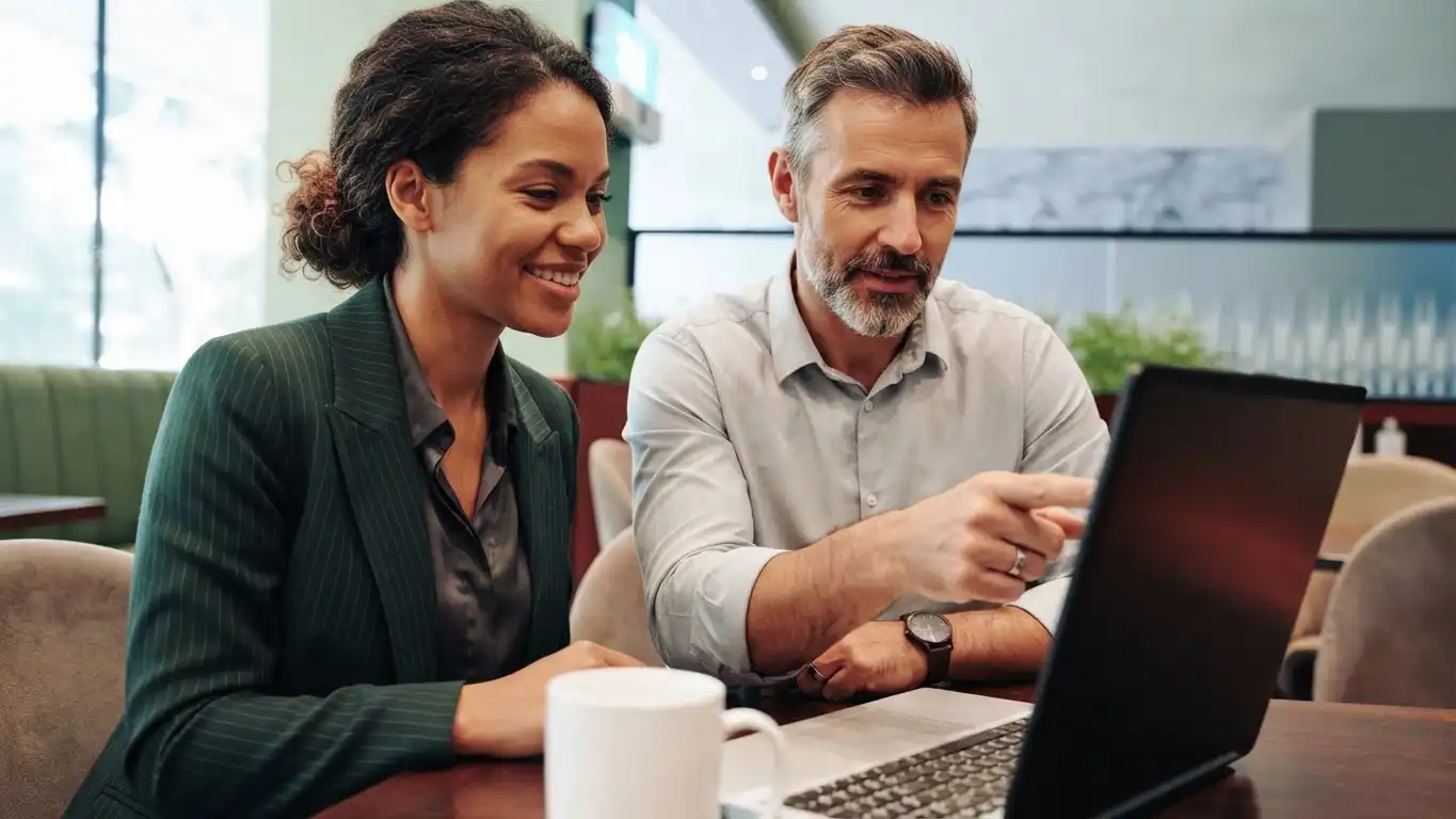 Two real estate agents working on their Google Business Profile