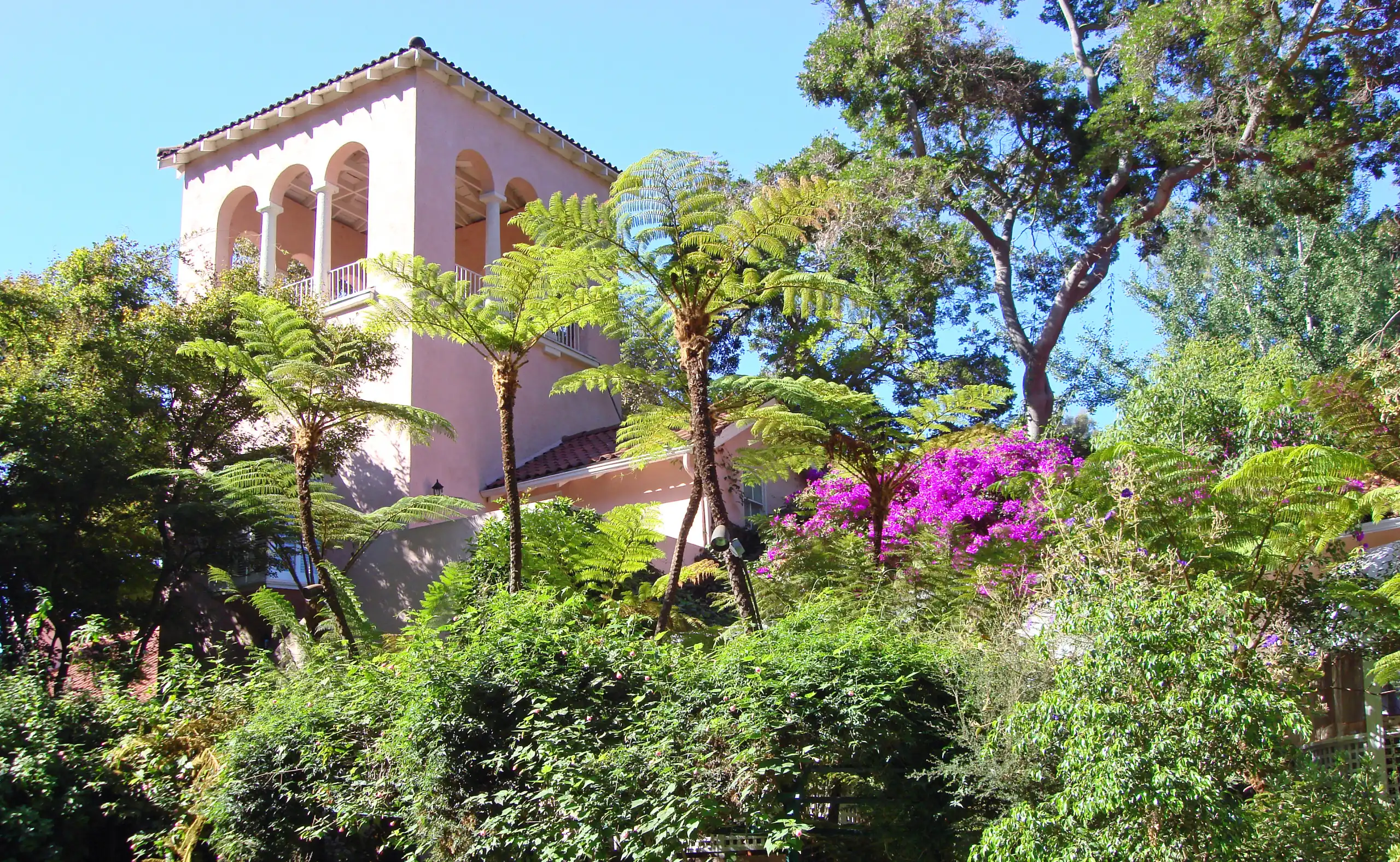 Gated luxury estate in Bel-Air, California, set behind hedges on an expansive hillside lot
