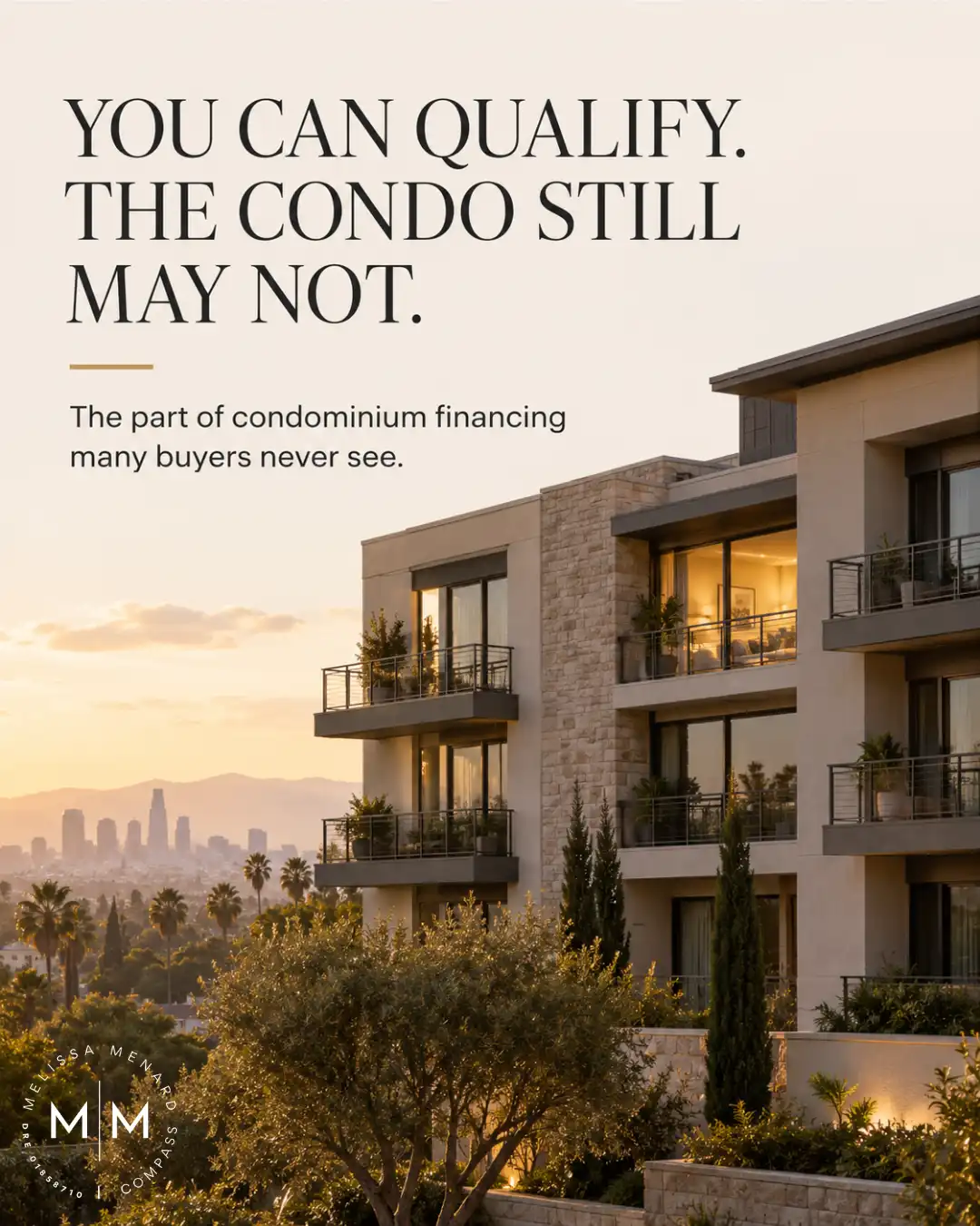 Modern condominium building with balconies and Los Angeles skyline at sunset.