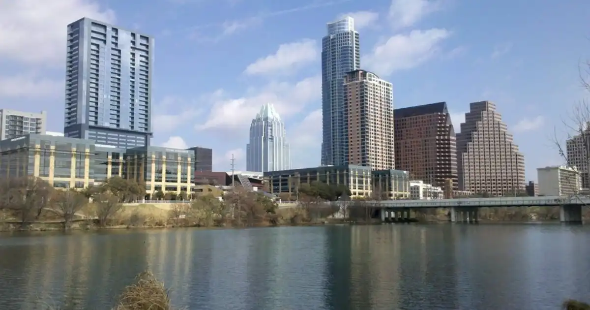 Downtown Austin skyline above Lady Bird Lake on a sunny day