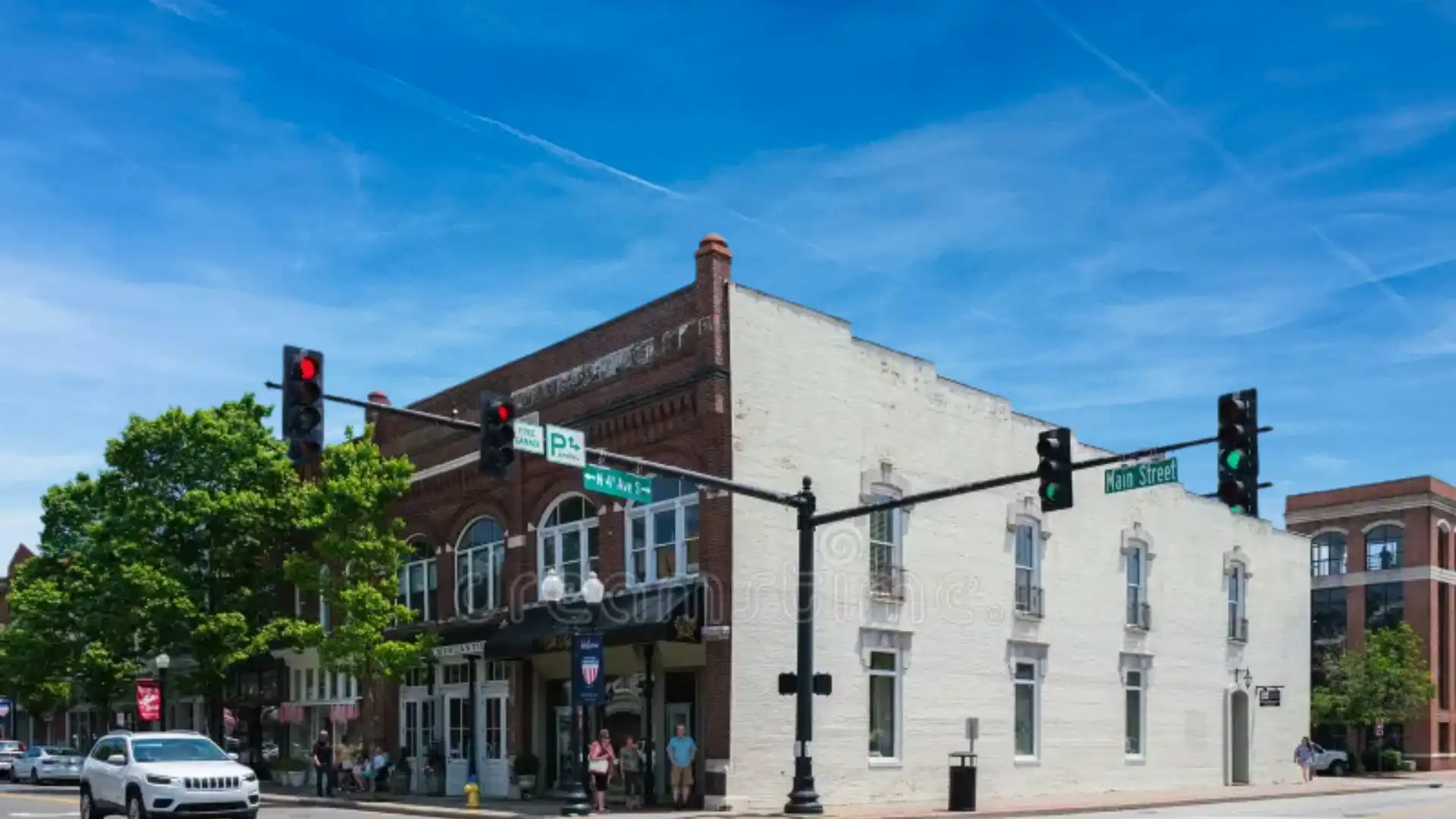 Street corner with historic brick buildings and traffic lights in 12 South Nashville with the neighborhood
