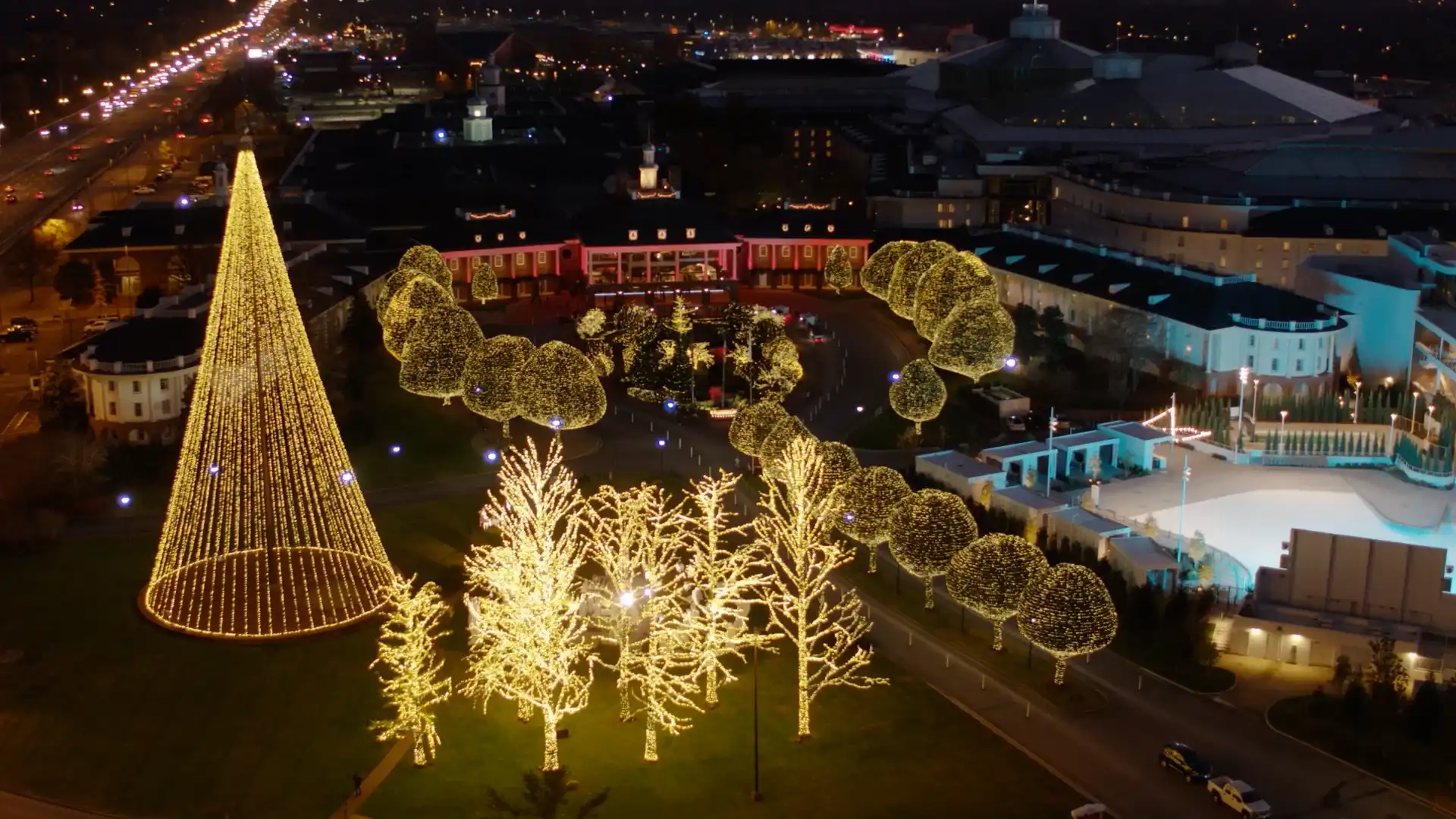 Holiday scene inside Opryland with Christmas lights and indoor garden