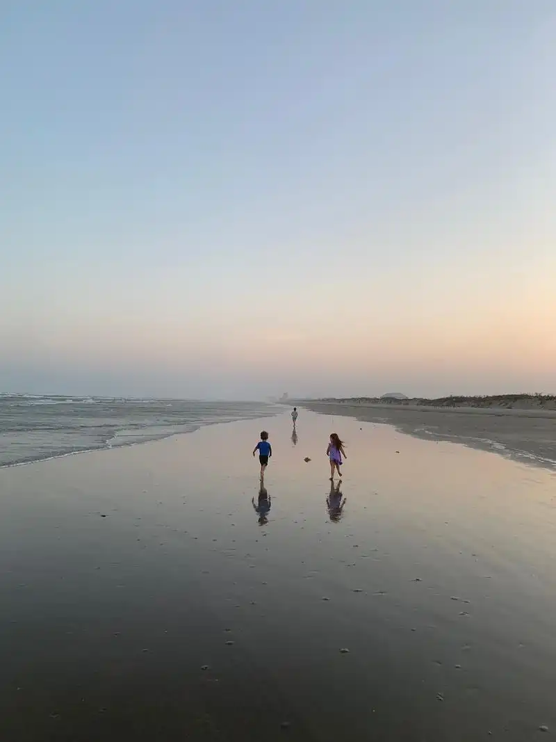 kids on beach at cinnamon shore